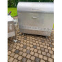 Charcoal grill with rotating spit