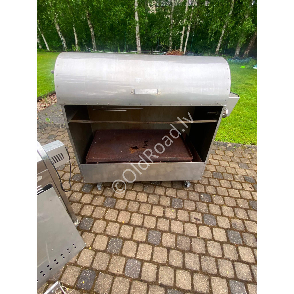 Charcoal grill with rotating spit