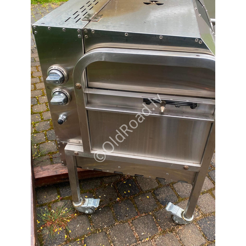 Gas grill with rotating spit
