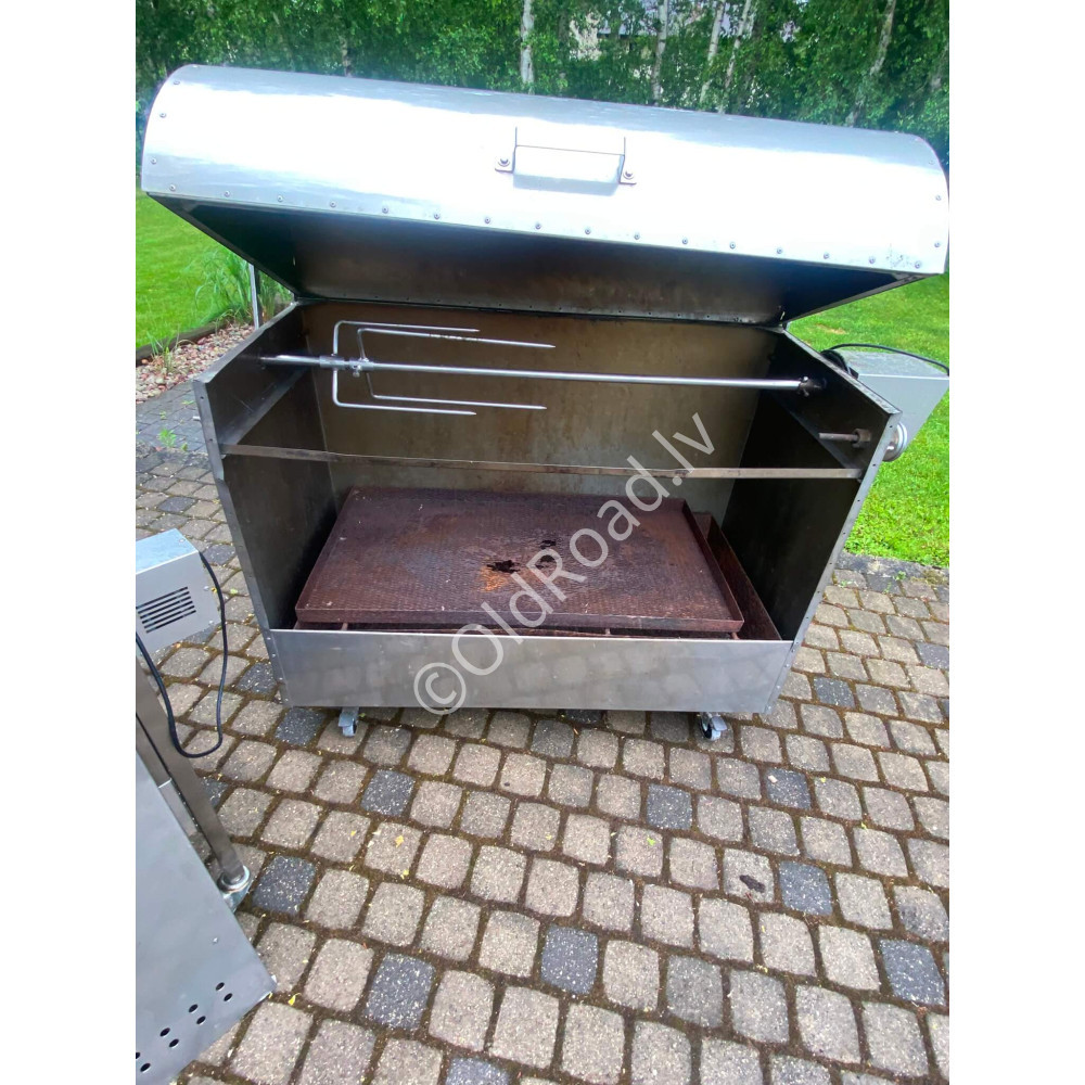 Charcoal grill with rotating spit